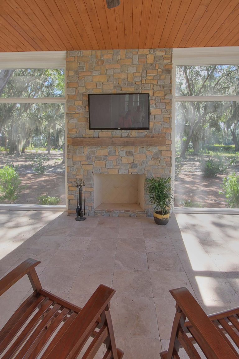 This is an example of a large traditional tile porch design in Atlanta with a roof extension.