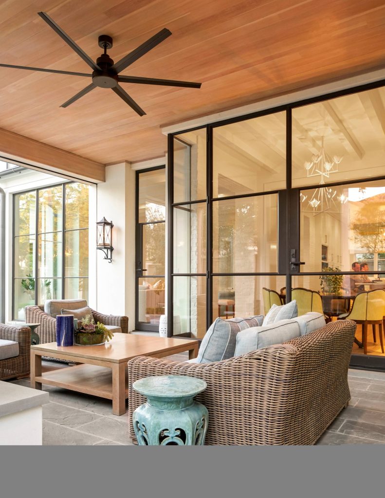 This is an example of a large transitional stone back porch design in Dallas with a roof extension. by Coats Homes | Outdoor Photos | Porch | Landscaping | Landscape Design | Outdoor Living Space | Porch Design Ideas | Outdoor Living Space Ideas | Backyard Design