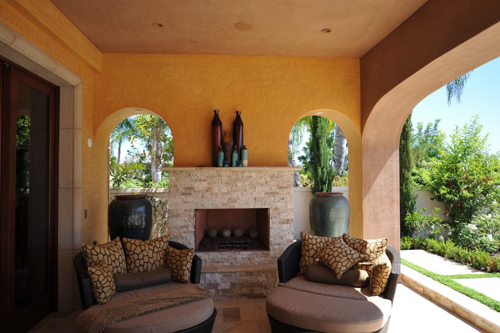 This is an example of a mediterranean back porch design in Orange County with a fire pit and a roof extension. by Crest Builders, Inc. | Outdoor Photos | Porch | Landscaping | Landscape Design | Outdoor Living Space | Porch Design Ideas | Outdoor Living Space Ideas | Backyard Design