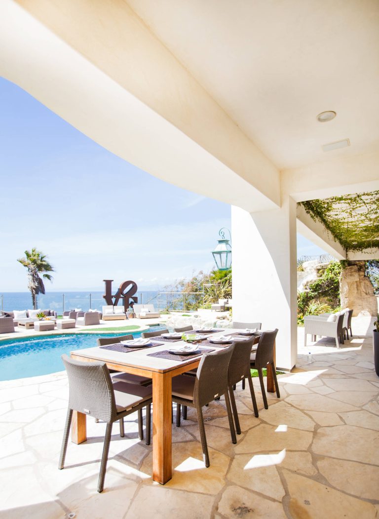 This is an example of a mediterranean stone porch design in Los Angeles with a roof extension. by Pretty Smart | Outdoor Photos | Porch | Landscaping | Landscape Design | Outdoor Living Space | Porch Design Ideas | Outdoor Living Space Ideas | Backyard Design