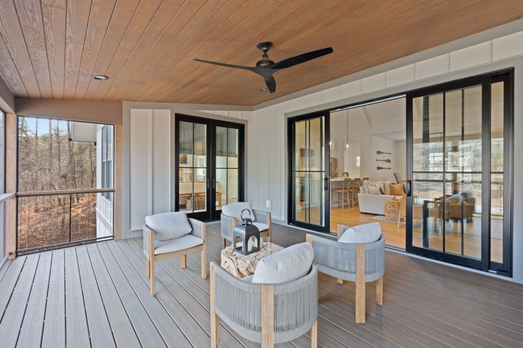 This is an example of a metal railing back porch design in Other with a roof extension. by Sexton Griffith Custom Builders | Outdoor Photos | Porch | Landscaping | Landscape Design | Outdoor Living Space | Porch Design Ideas | Outdoor Living Space Ideas | Backyard Design