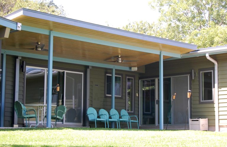 This is an example of a mid-century modern porch design in Austin with a roof extension. by Merzbau Design Collective | Outdoor Photos | Porch | Landscaping | Landscape Design | Outdoor Living Space | Porch Design Ideas | Outdoor Living Space Ideas | Backyard Design