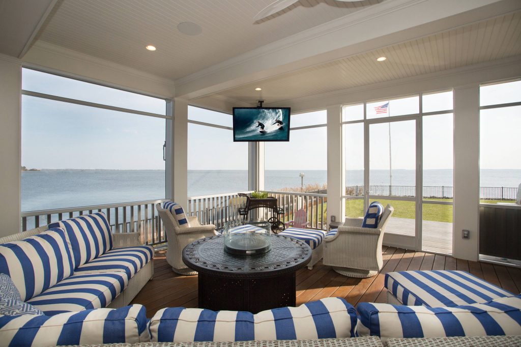 This is an example of a mid-sized coastal back porch design in Other with decking and a roof extension. by Overture Ultimate Home Electronics | Outdoor Photos | Porch | Landscaping | Landscape Design | Outdoor Living Space | Porch Design Ideas | Outdoor Living Space Ideas | Backyard Design