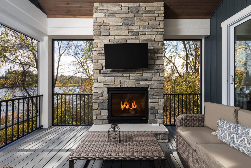 This is an example of a mid-sized coastal screened-in porch design in Grand Rapids with a roof extension and decking. by Snowden Builders LLC | Outdoor Photos | Porch | Landscaping | Landscape Design | Outdoor Living Space | Porch Design Ideas | Outdoor Living Space Ideas | Backyard Design