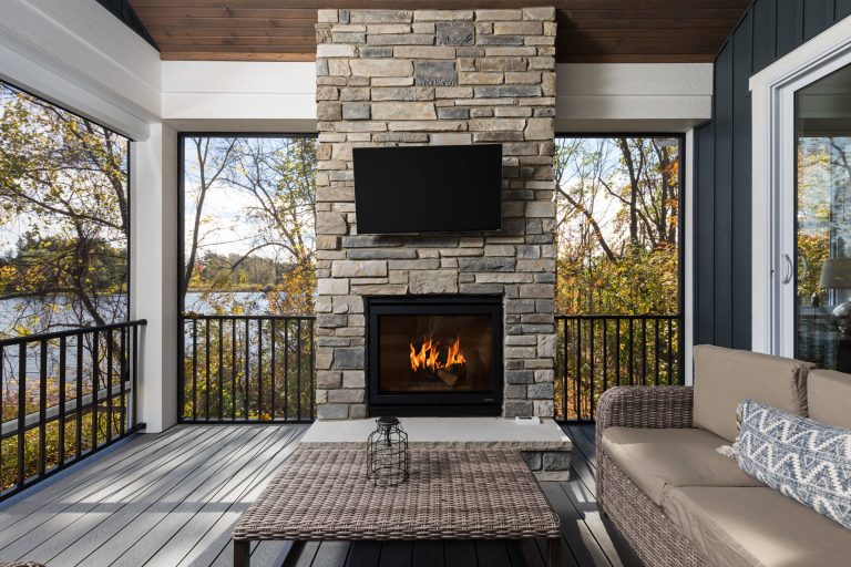 This is an example of a mid-sized coastal screened-in porch design in Grand Rapids with a roof extension and decking. by Snowden Builders LLC | Outdoor Photos | Porch | Landscaping | Landscape Design | Outdoor Living Space | Porch Design Ideas | Outdoor Living Space Ideas | Backyard Design