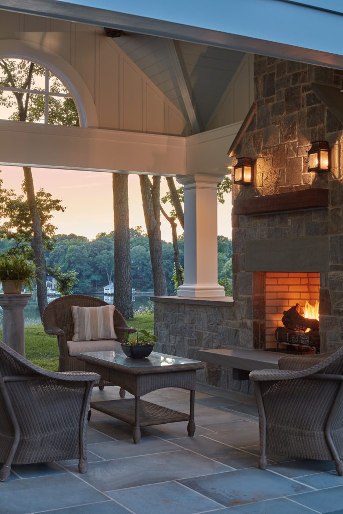 This is an example of a mid-sized coastal stone back porch design in DC Metro with a fireplace and a pergola. by Melissa McLay Interiors | Outdoor Photos | Porch | Landscaping | Landscape Design | Outdoor Living Space | Porch Design Ideas | Outdoor Living Space Ideas | Backyard Design