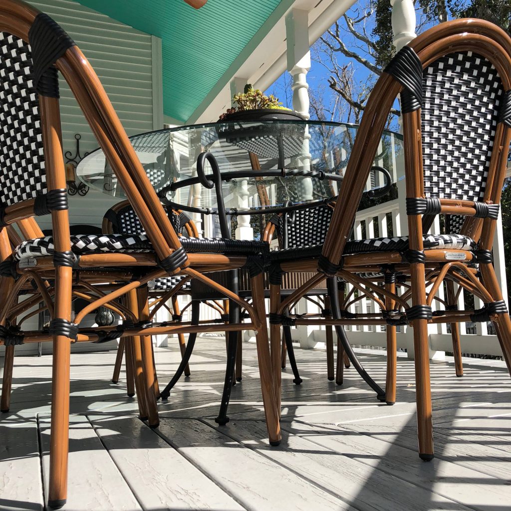 This is an example of a mid-sized contemporary back porch design in Jacksonville with a roof extension. by Jody Marcil Interior Design | Outdoor Photos | Porch | Landscaping | Landscape Design | Outdoor Living Space | Porch Design Ideas | Outdoor Living Space Ideas | Backyard Design