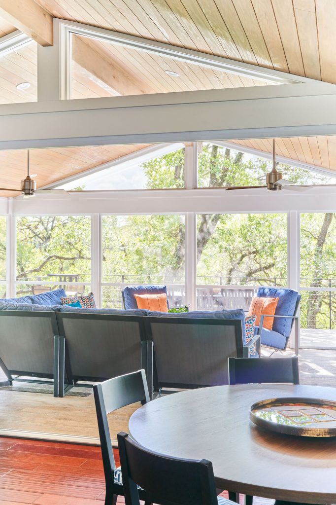 This is an example of a mid-sized contemporary screened-in and cable railing back porch design in Austin with a roof extension. by CG&S Design-Build | Outdoor Photos | Porch | Landscaping | Landscape Design | Outdoor Living Space | Porch Design Ideas | Outdoor Living Space Ideas | Backyard Design