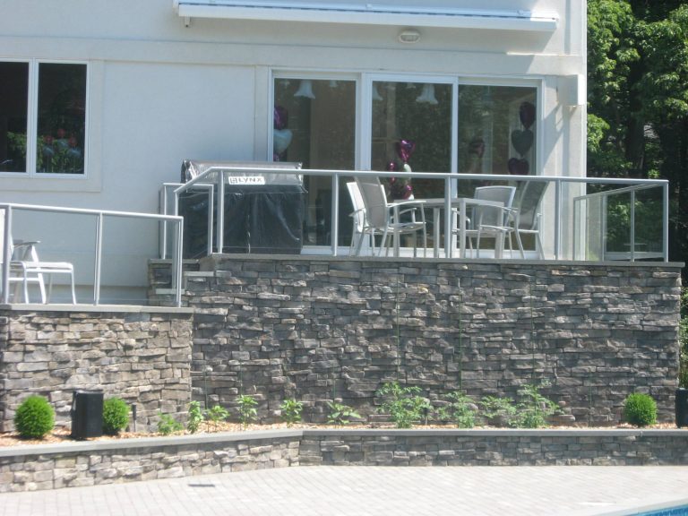 This is an example of a mid-sized contemporary stone back porch design in New York. by Duke of Iron | Outdoor Photos | Porch | Landscaping | Landscape Design | Outdoor Living Space | Porch Design Ideas | Outdoor Living Space Ideas | Backyard Design