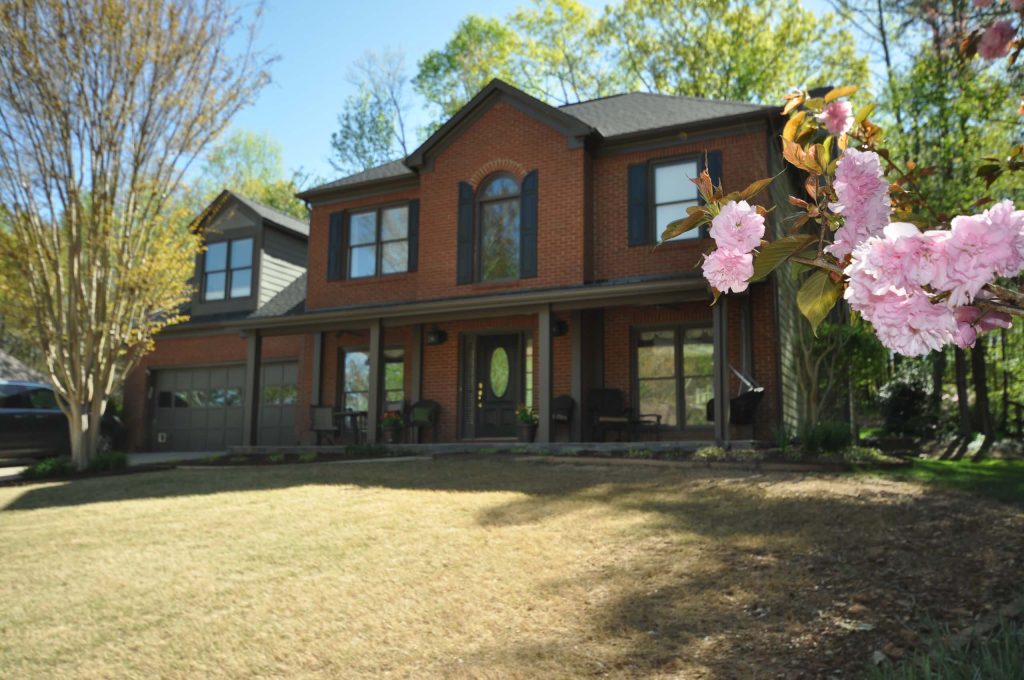 This is an example of a mid-sized contemporary tile front porch design in Atlanta with a roof extension. by Taber Residential | Outdoor Photos | Porch | Landscaping | Landscape Design | Outdoor Living Space | Porch Design Ideas | Outdoor Living Space Ideas | Backyard Design