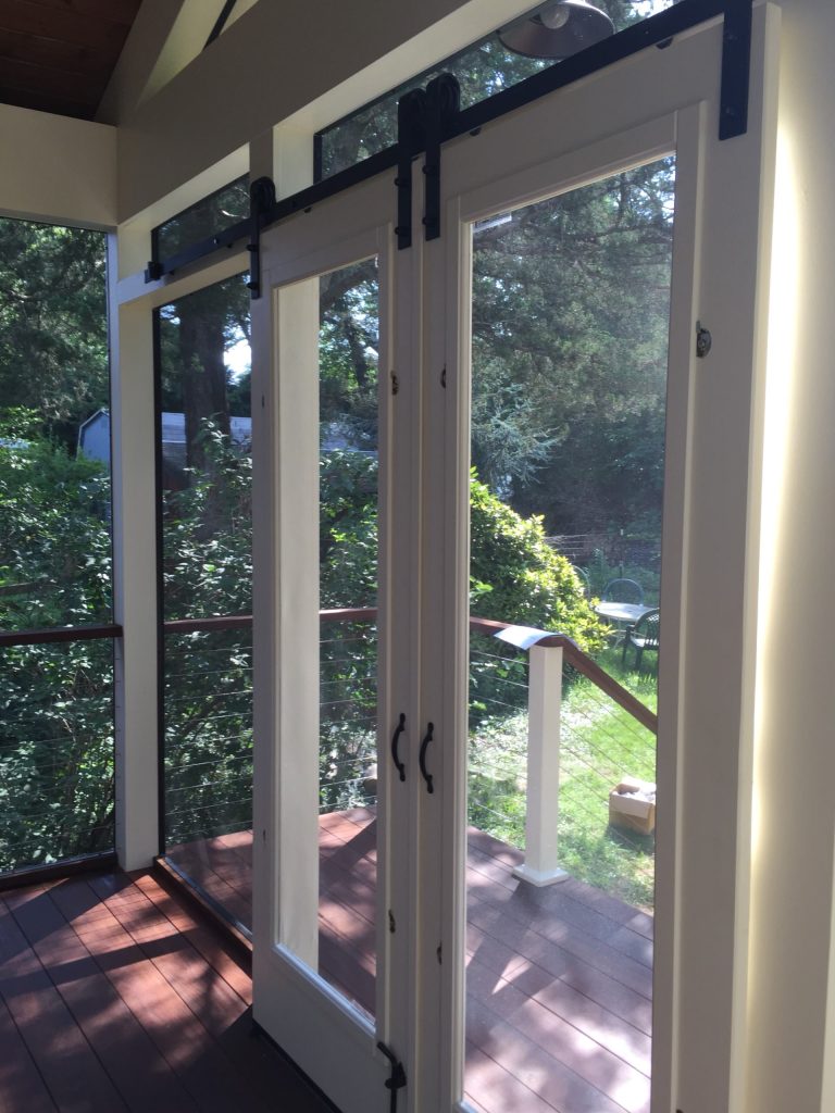 This is an example of a mid-sized cottage screened-in back porch design in Other with decking and a roof extension. by Integrity Design + Build | Outdoor Photos | Porch | Landscaping | Landscape Design | Outdoor Living Space | Porch Design Ideas | Outdoor Living Space Ideas | Backyard Design