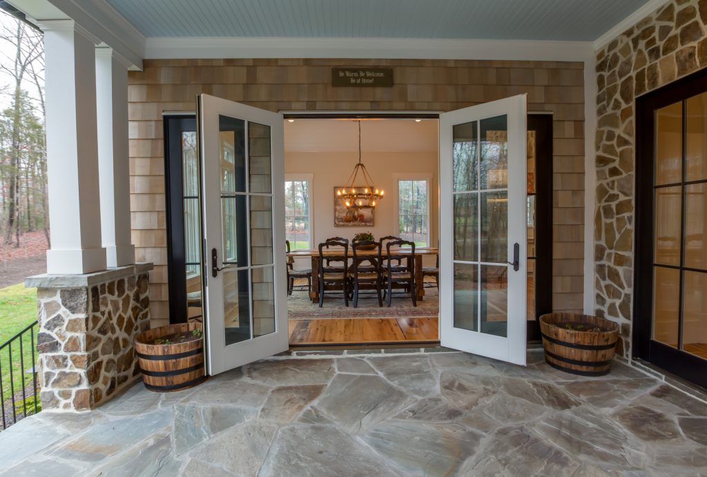 This is an example of a mid-sized cottage stone back porch design in Charlotte with a roof extension. by Circle Construction Services | Outdoor Photos | Porch | Landscaping | Landscape Design | Outdoor Living Space | Porch Design Ideas | Outdoor Living Space Ideas | Backyard Design