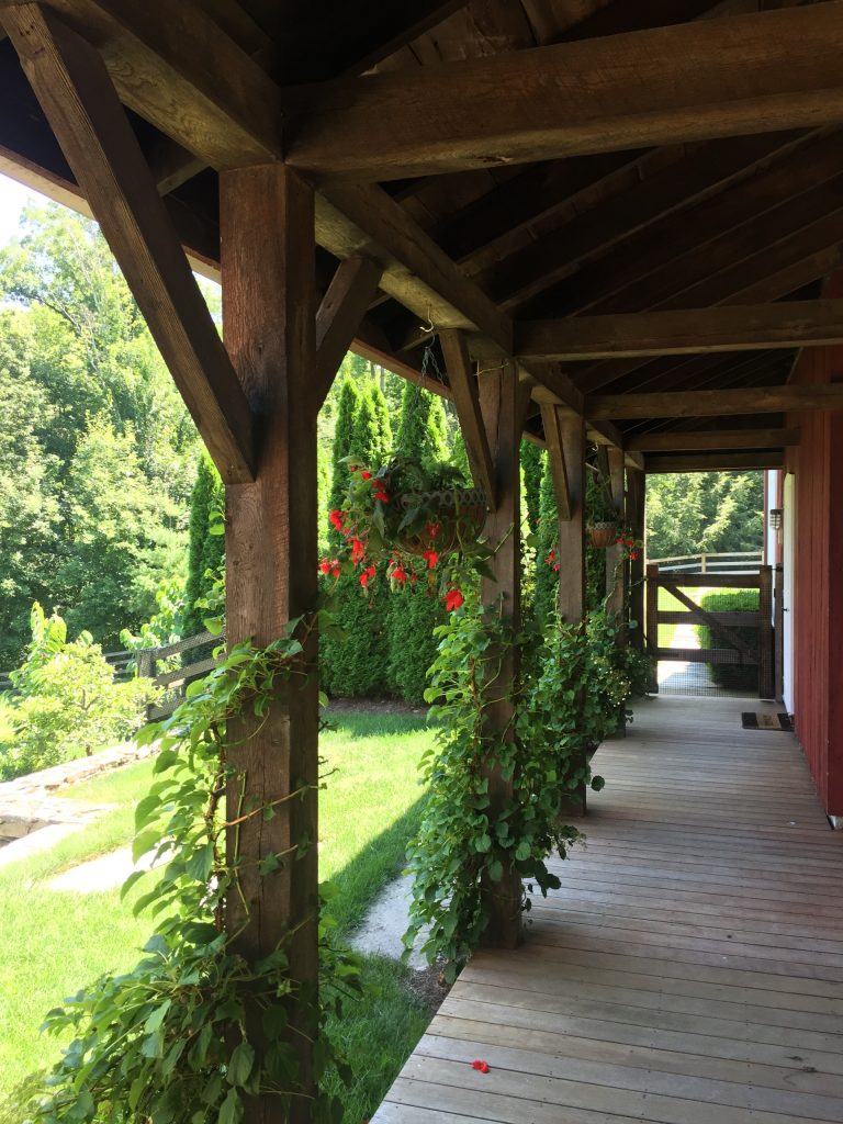 This is an example of a mid-sized country back porch design in Bridgeport. by J.C. Merritt Inc. | Outdoor Photos | Porch | Landscaping | Landscape Design | Outdoor Living Space | Porch Design Ideas | Outdoor Living Space Ideas | Backyard Design