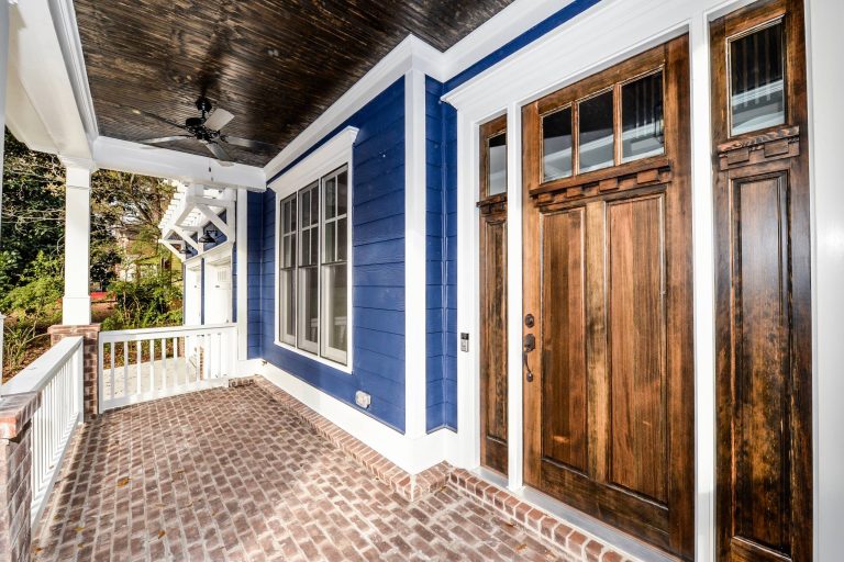 This is an example of a mid-sized craftsman brick front porch design in Atlanta with a roof extension. by Waterford Homes | Outdoor Photos | Porch | Landscaping | Landscape Design | Outdoor Living Space | Porch Design Ideas | Outdoor Living Space Ideas | Backyard Design