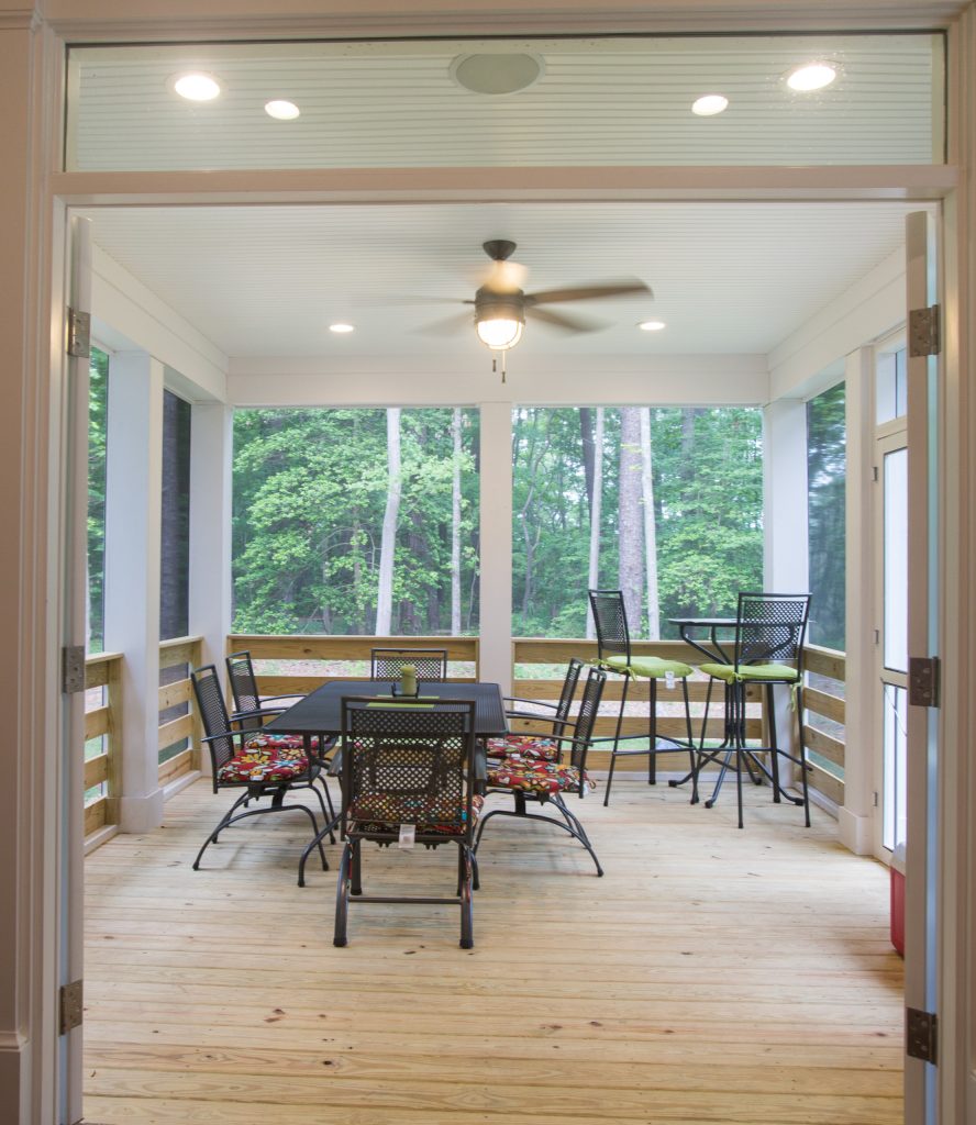 This is an example of a mid-sized craftsman screened-in back porch design in Other with decking and a roof extension. by J.M. Froehler Construction | Outdoor Photos | Porch | Landscaping | Landscape Design | Outdoor Living Space | Porch Design Ideas | Outdoor Living Space Ideas | Backyard Design