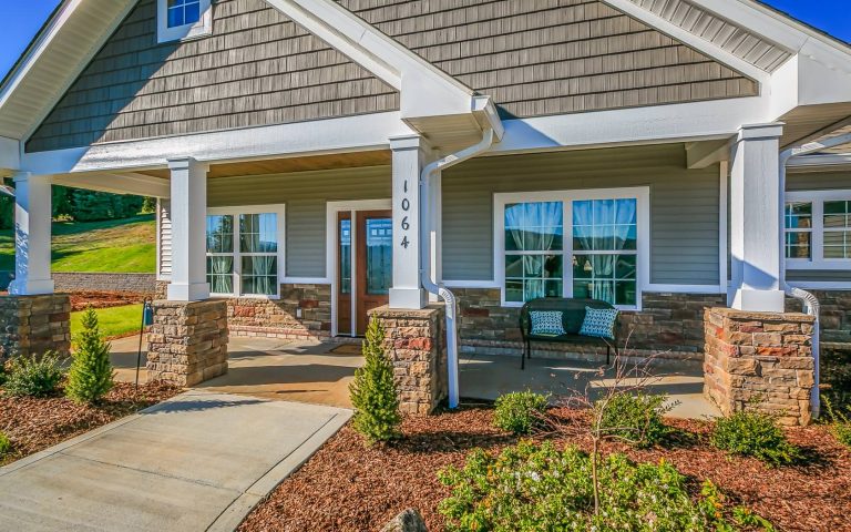 This is an example of a mid-sized craftsman stone back porch design in Other with a roof extension. by Jeff Spear Homes | Outdoor Photos | Porch | Landscaping | Landscape Design | Outdoor Living Space | Porch Design Ideas | Outdoor Living Space Ideas | Backyard Design