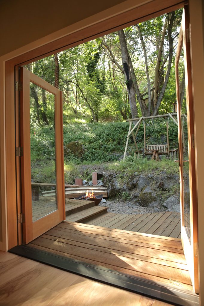 This is an example of a mid-sized eclectic back porch design in Other with a fire pit. by Sivesind Construction | Outdoor Photos | Porch | Landscaping | Landscape Design | Outdoor Living Space | Porch Design Ideas | Outdoor Living Space Ideas | Backyard Design