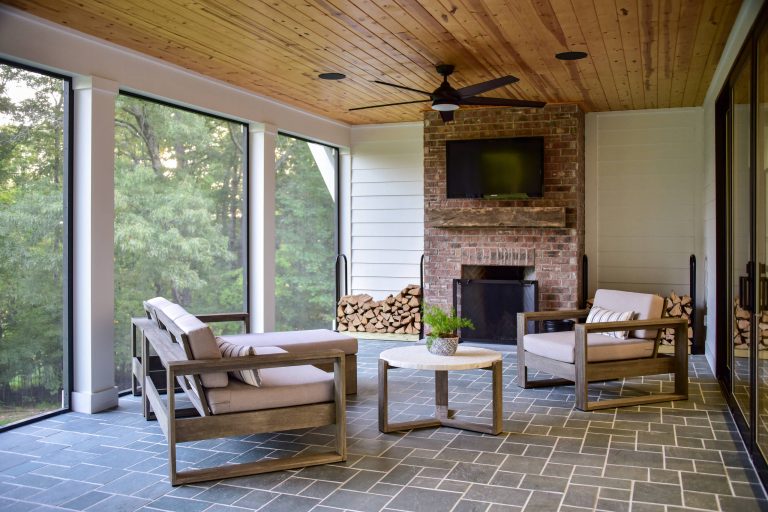 This is an example of a mid-sized farmhouse stone back porch design in Other with a fireplace and a roof extension. by Jonathan Miller Architects | Outdoor Photos | Porch | Landscaping | Landscape Design | Outdoor Living Space | Porch Design Ideas | Outdoor Living Space Ideas | Backyard Design