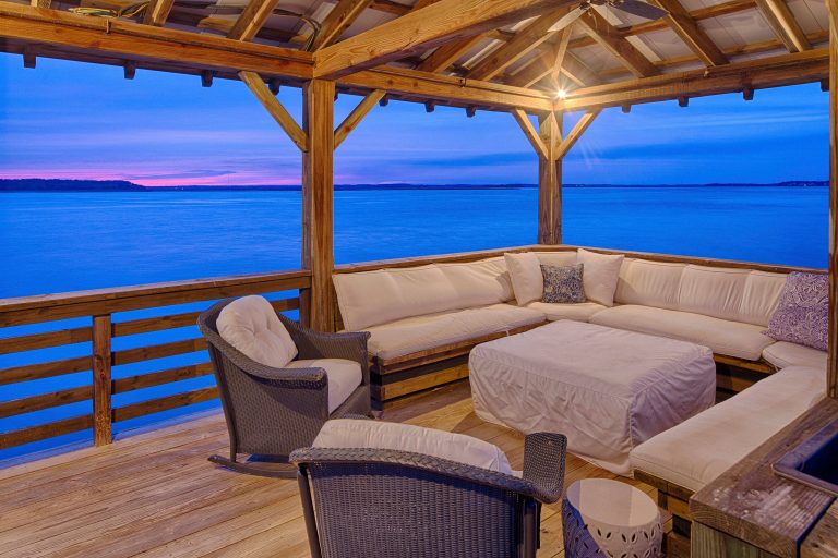 This is an example of a mid-sized mediterranean back porch design in Atlanta with a roof extension and decking. by Randolph Stewart | Outdoor Photos | Porch | Landscaping | Landscape Design | Outdoor Living Space | Porch Design Ideas | Outdoor Living Space Ideas | Backyard Design