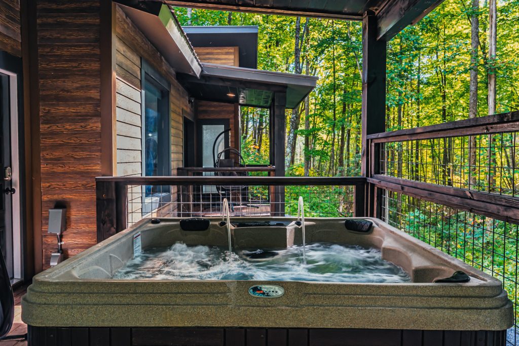 This is an example of a mid-sized modern metal railing front porch design in Houston with decking and a roof extension. by Wyrick Residential Design | Outdoor Photos | Porch | Landscaping | Landscape Design | Outdoor Living Space | Porch Design Ideas | Outdoor Living Space Ideas | Backyard Design