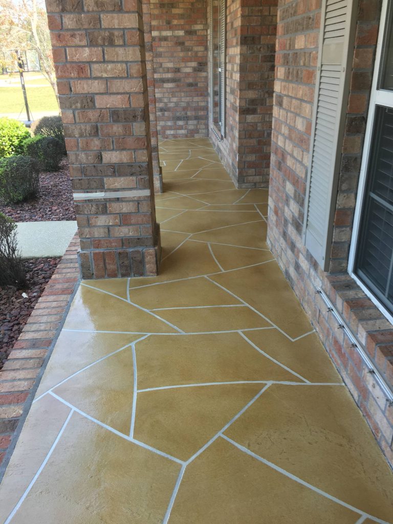 This is an example of a mid-sized modern stamped concrete front porch design in Other with a roof extension. by Seaside Surfaces LLC | Outdoor Photos | Porch | Landscaping | Landscape Design | Outdoor Living Space | Porch Design Ideas | Outdoor Living Space Ideas | Backyard Design