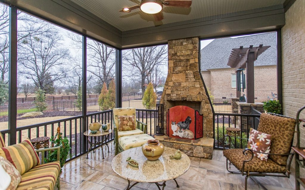 This is an example of a mid-sized rustic tile screened-in back porch design in Other with a roof extension. by Galloway Custom Homes, LLC | Outdoor Photos | Porch | Landscaping | Landscape Design | Outdoor Living Space | Porch Design Ideas | Outdoor Living Space Ideas | Backyard Design