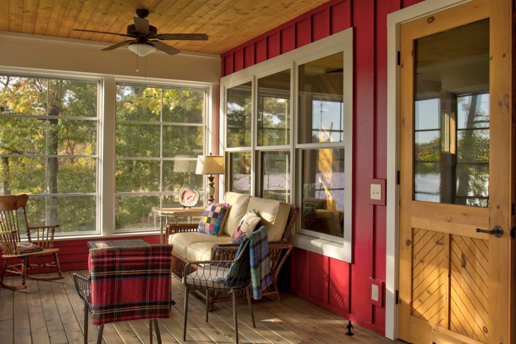 This is an example of a mid-sized scandinavian screened-in back porch design in Minneapolis with decking and a roof extension. by Lands End Development - Designers & Builders | Outdoor Photos | Porch | Landscaping | Landscape Design | Outdoor Living Space | Porch Design Ideas | Outdoor Living Space Ideas | Backyard Design