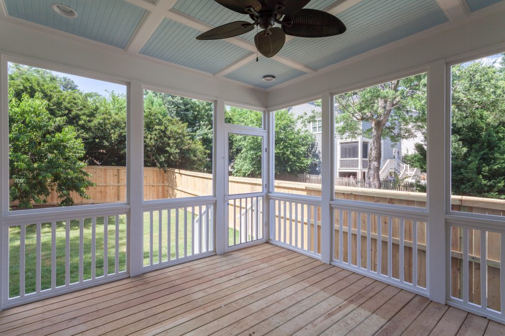 This is an example of a mid-sized screened-in back porch design in Raleigh with decking and a roof extension. by Davenport and Anderson Homes | Outdoor Photos | Porch | Landscaping | Landscape Design | Outdoor Living Space | Porch Design Ideas | Outdoor Living Space Ideas | Backyard Design
