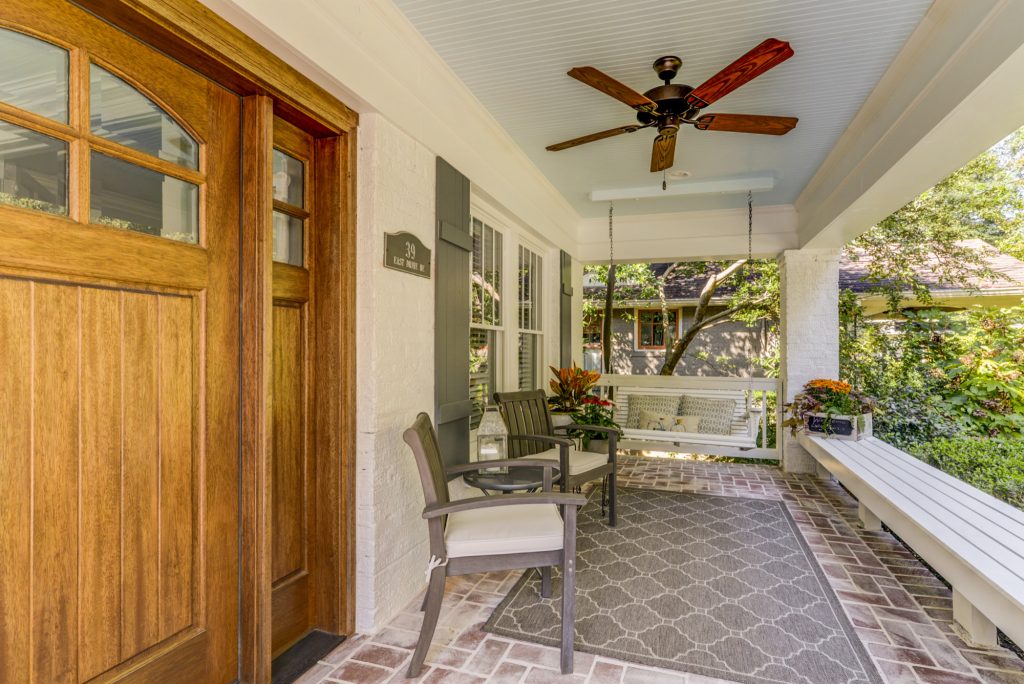 This is an example of a mid-sized traditional brick front porch design in Atlanta with a roof extension. by A Classical Studio | Outdoor Photos | Porch | Landscaping | Landscape Design | Outdoor Living Space | Porch Design Ideas | Outdoor Living Space Ideas | Backyard Design