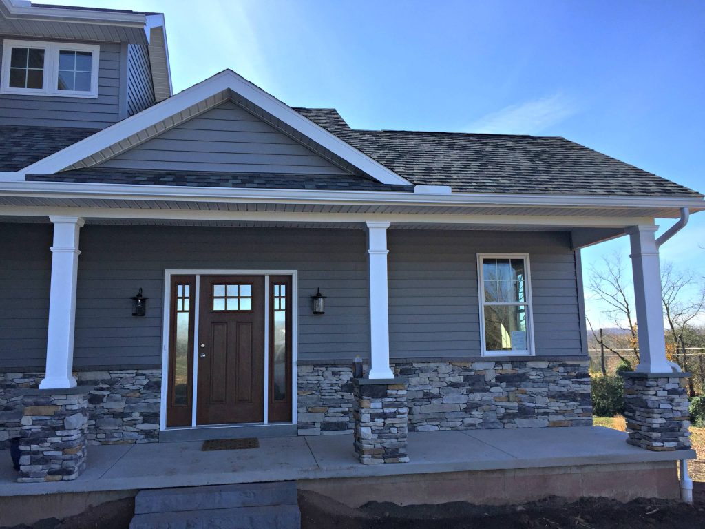 This is an example of a mid-sized traditional concrete front porch design in Philadelphia with a roof extension. by LA Kehres Building | Outdoor Photos | Porch | Landscaping | Landscape Design | Outdoor Living Space | Porch Design Ideas | Outdoor Living Space Ideas | Backyard Design