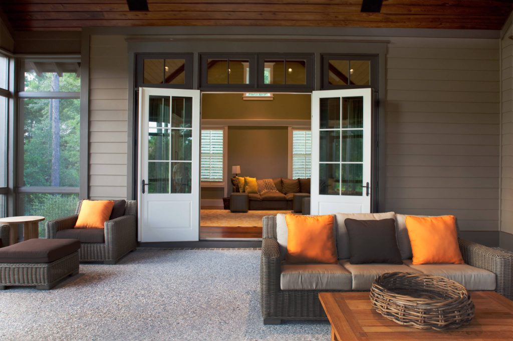 This is an example of a mid-sized traditional concrete screened-in back porch design in Charleston with a roof extension. by Court Atkins Group | Outdoor Photos | Porch | Landscaping | Landscape Design | Outdoor Living Space | Porch Design Ideas | Outdoor Living Space Ideas | Backyard Design