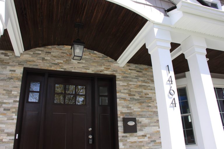 This is an example of a mid-sized traditional front porch design in Detroit. by Oliver Construction, Inc. | Outdoor Photos | Porch | Landscaping | Landscape Design | Outdoor Living Space | Porch Design Ideas | Outdoor Living Space Ideas | Backyard Design