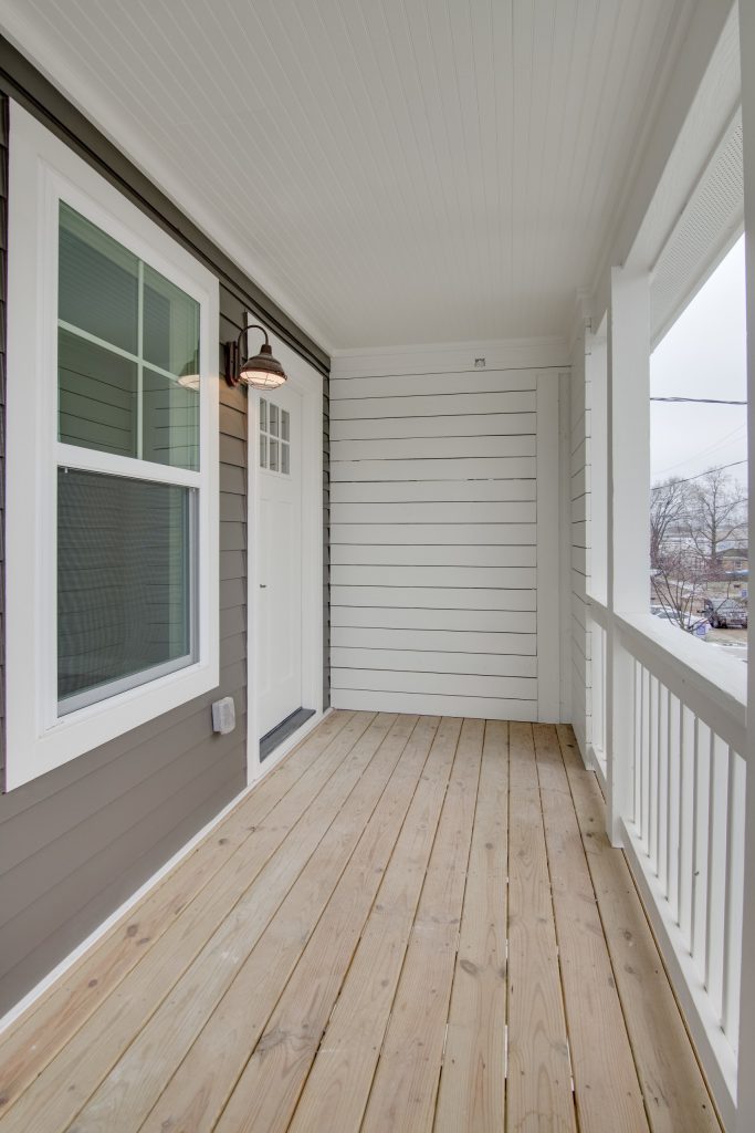 This is an example of a mid-sized traditional front porch design in Nashville with decking and a roof extension. by White Pines Building Group | Outdoor Photos | Porch | Landscaping | Landscape Design | Outdoor Living Space | Porch Design Ideas | Outdoor Living Space Ideas | Backyard Design