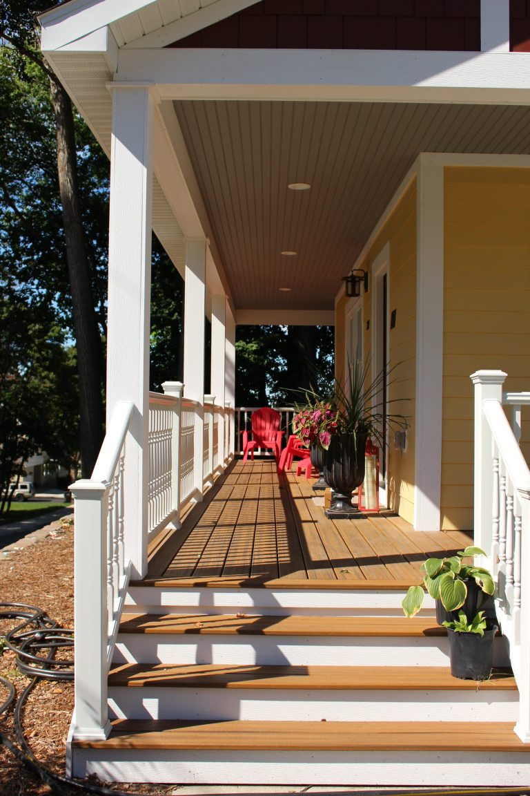 This is an example of a mid-sized traditional front porch design in Other with decking and a roof extension. by Uptown Build, LLC | Outdoor Photos | Porch | Landscaping | Landscape Design | Outdoor Living Space | Porch Design Ideas | Outdoor Living Space Ideas | Backyard Design