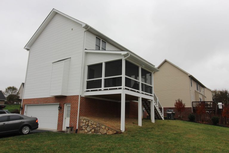 This is an example of a mid-sized traditional screened-in back porch design in Other with a roof extension. by Construction Marketing, LLC | Outdoor Photos | Porch | Landscaping | Landscape Design | Outdoor Living Space | Porch Design Ideas | Outdoor Living Space Ideas | Backyard Design
