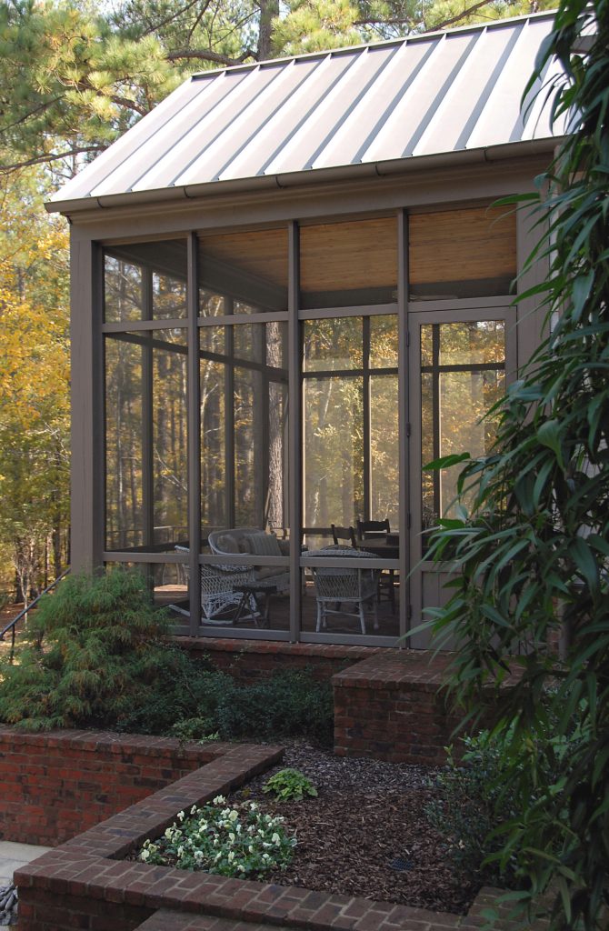 This is an example of a mid-sized traditional screened-in side porch design in Other with a roof extension. by Looney Ricks Kiss | Outdoor Photos | Porch | Landscaping | Landscape Design | Outdoor Living Space | Porch Design Ideas | Outdoor Living Space Ideas | Backyard Design