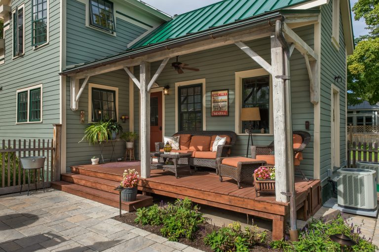 This is an example of a mid-sized traditional side porch design in Boston with decking and a roof extension. by SD Atelier Architecture | Outdoor Photos | Porch | Landscaping | Landscape Design | Outdoor Living Space | Porch Design Ideas | Outdoor Living Space Ideas | Backyard Design