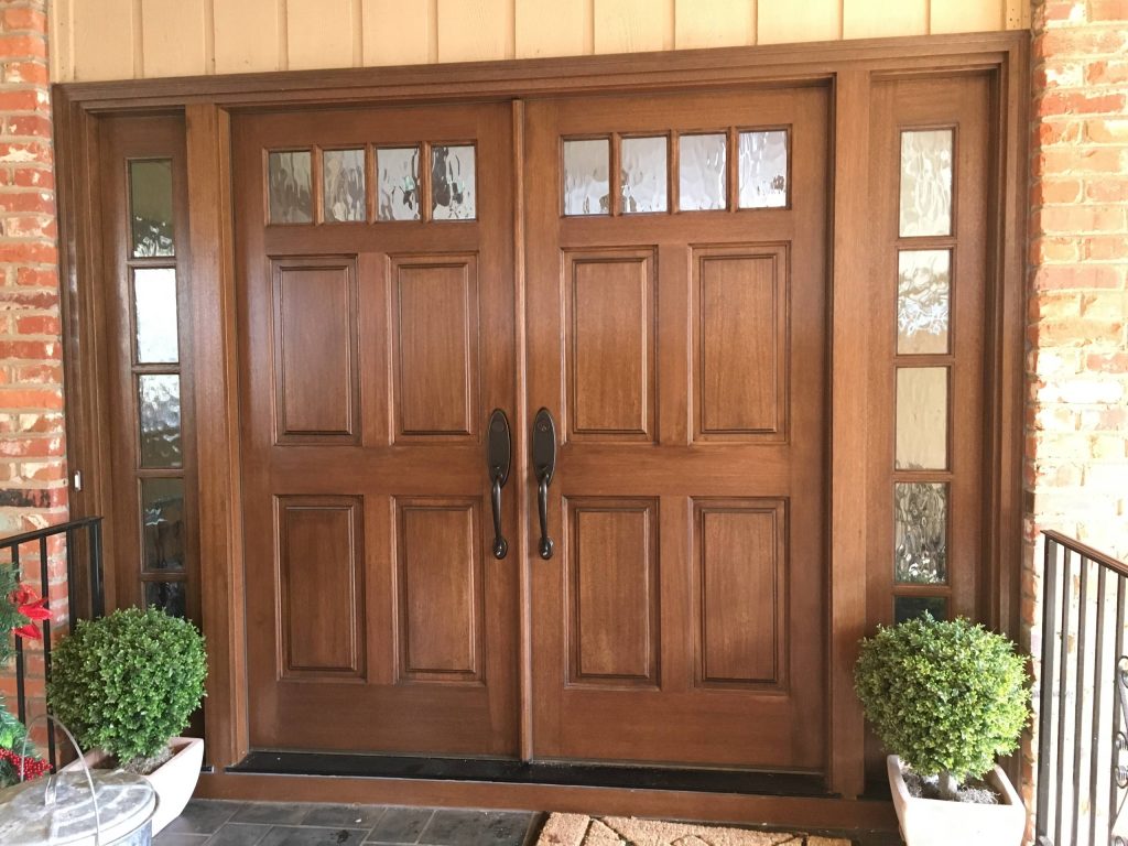 This is an example of a mid-sized traditional tile front porch design in Raleigh with a roof extension. by Southern Custom Doors | Outdoor Photos | Porch | Landscaping | Landscape Design | Outdoor Living Space | Porch Design Ideas | Outdoor Living Space Ideas | Backyard Design