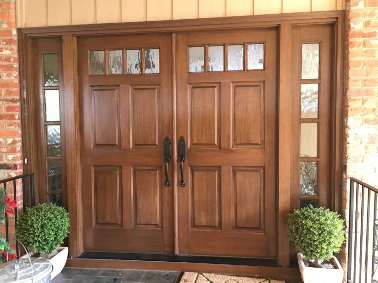 This is an example of a mid-sized traditional tile front porch design in Raleigh with a roof extension. by Southern Custom Doors | Outdoor Photos | Porch | Landscaping | Landscape Design | Outdoor Living Space | Porch Design Ideas | Outdoor Living Space Ideas | Backyard Design
