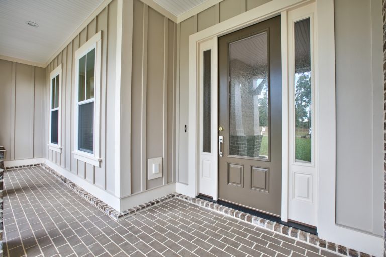 This is an example of a mid-sized transitional brick front porch design in Atlanta with a roof extension. by White Oak Construction LLC | Outdoor Photos | Porch | Landscaping | Landscape Design | Outdoor Living Space | Porch Design Ideas | Outdoor Living Space Ideas | Backyard Design