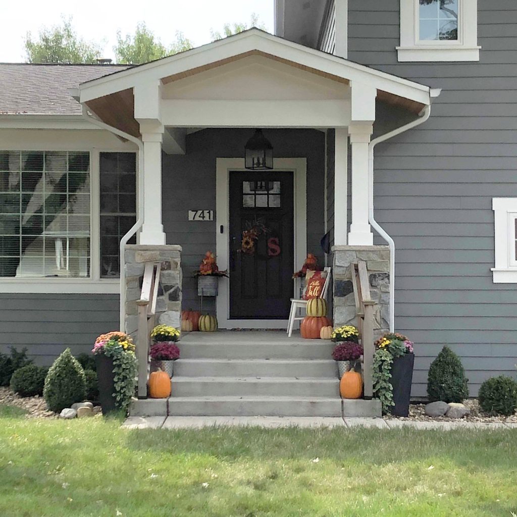 This is an example of a mid-sized transitional concrete paver mixed material railing porch design in Chicago with a roof extension. by 12/12 Architects & Planners | Outdoor Photos | Porch | Landscaping | Landscape Design | Outdoor Living Space | Porch Design Ideas | Outdoor Living Space Ideas | Backyard Design