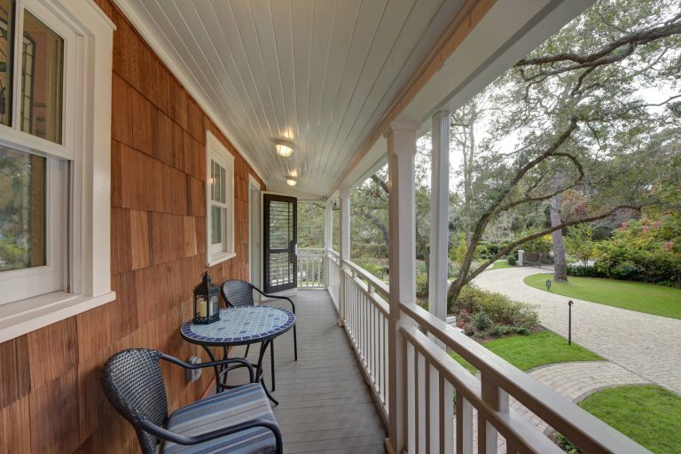 This is an example of a mid-sized transitional front porch design in Jacksonville with decking and a roof extension. by David E. Amos, Architect, LLC | Outdoor Photos | Porch | Landscaping | Landscape Design | Outdoor Living Space | Porch Design Ideas | Outdoor Living Space Ideas | Backyard Design