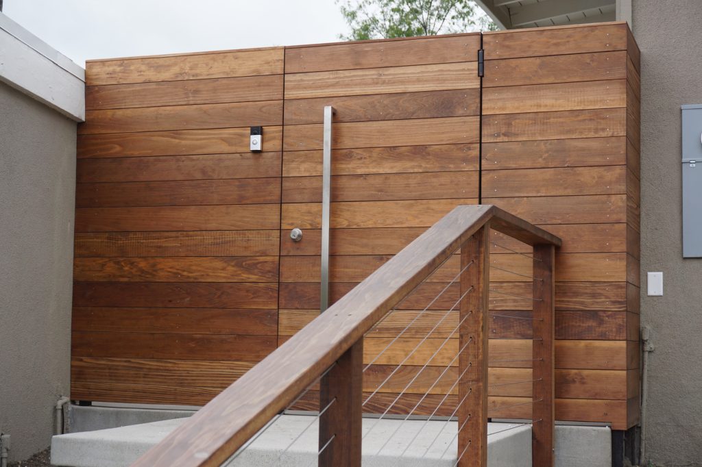 This is an example of a mid-sized modern partial sun backyard concrete paver landscaping in Los Angeles.