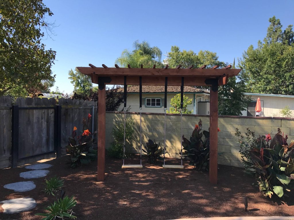 This is an example of a mid-sized shade backyard mulch formal garden in Other.