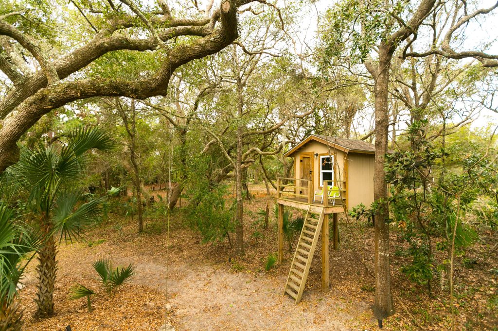 This is an example of a rustic backyard outdoor playset in Charleston.