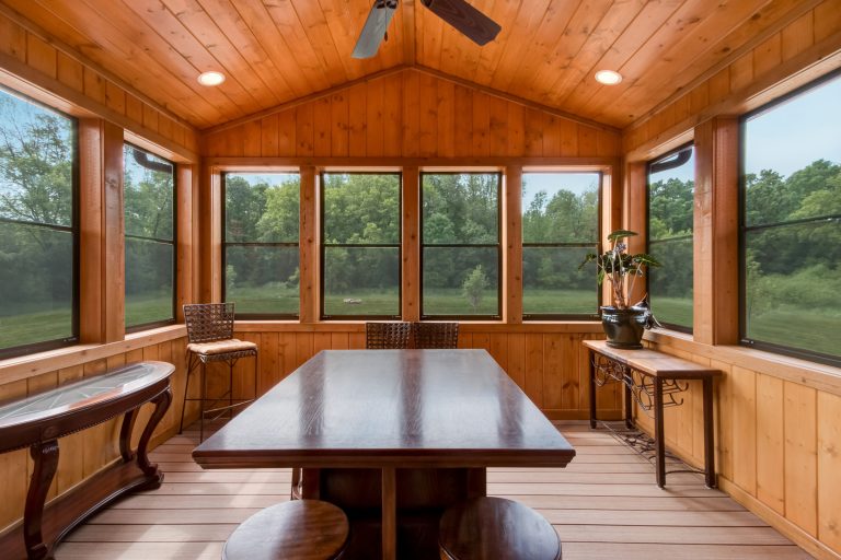 This is an example of a rustic front porch design in Milwaukee with a roof extension. by C. Weber Builders, Inc. | Outdoor Photos | Porch | Landscaping | Landscape Design | Outdoor Living Space | Porch Design Ideas | Outdoor Living Space Ideas | Backyard Design