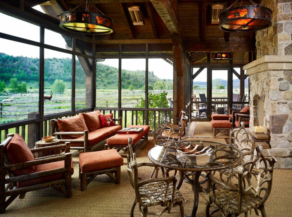 This is an example of a rustic screened-in porch design in Denver with a roof extension. by RMT Architects | Outdoor Photos | Porch | Landscaping | Landscape Design | Outdoor Living Space | Porch Design Ideas | Outdoor Living Space Ideas | Backyard Design