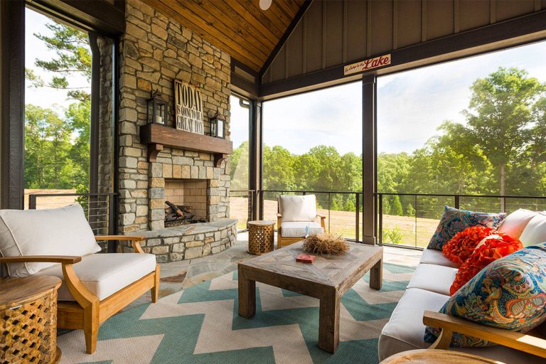 This is an example of a rustic stone screened-in porch design in Other with a roof extension. by Samson Stone | Outdoor Photos | Porch | Landscaping | Landscape Design | Outdoor Living Space | Porch Design Ideas | Outdoor Living Space Ideas | Backyard Design