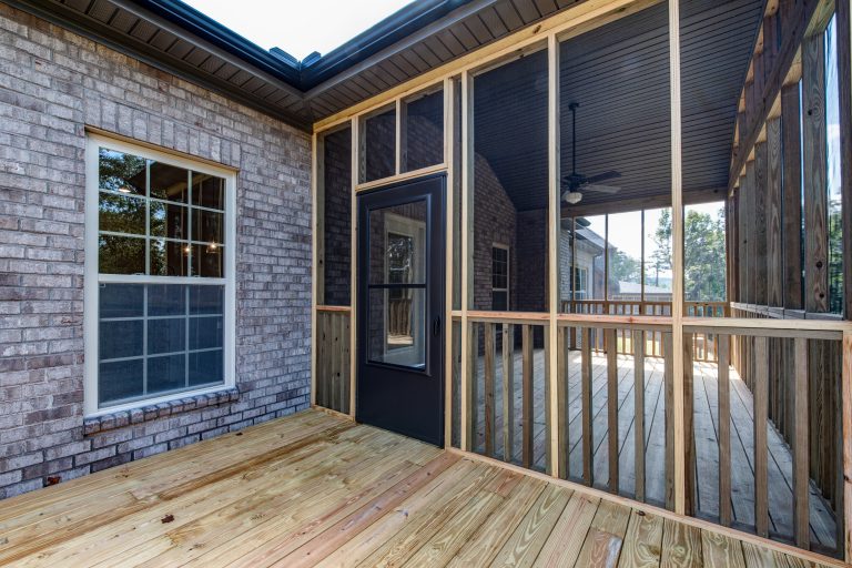 This is an example of a screened-in back porch design in Other. by HMH Development, Inc. | Outdoor Photos | Porch | Landscaping | Landscape Design | Outdoor Living Space | Porch Design Ideas | Outdoor Living Space Ideas | Backyard Design