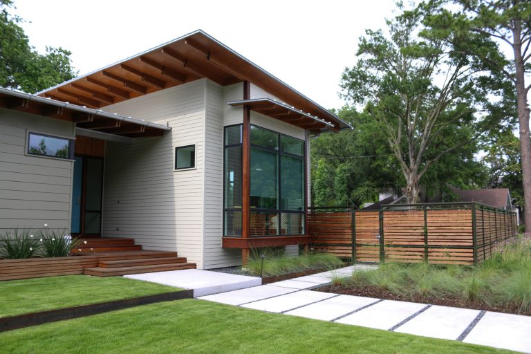 This is an example of a small modern front porch design in Houston with a roof extension. by Urbanscapes LLC | Outdoor Photos | Porch | Landscaping | Landscape Design | Outdoor Living Space | Porch Design Ideas | Outdoor Living Space Ideas | Backyard Design